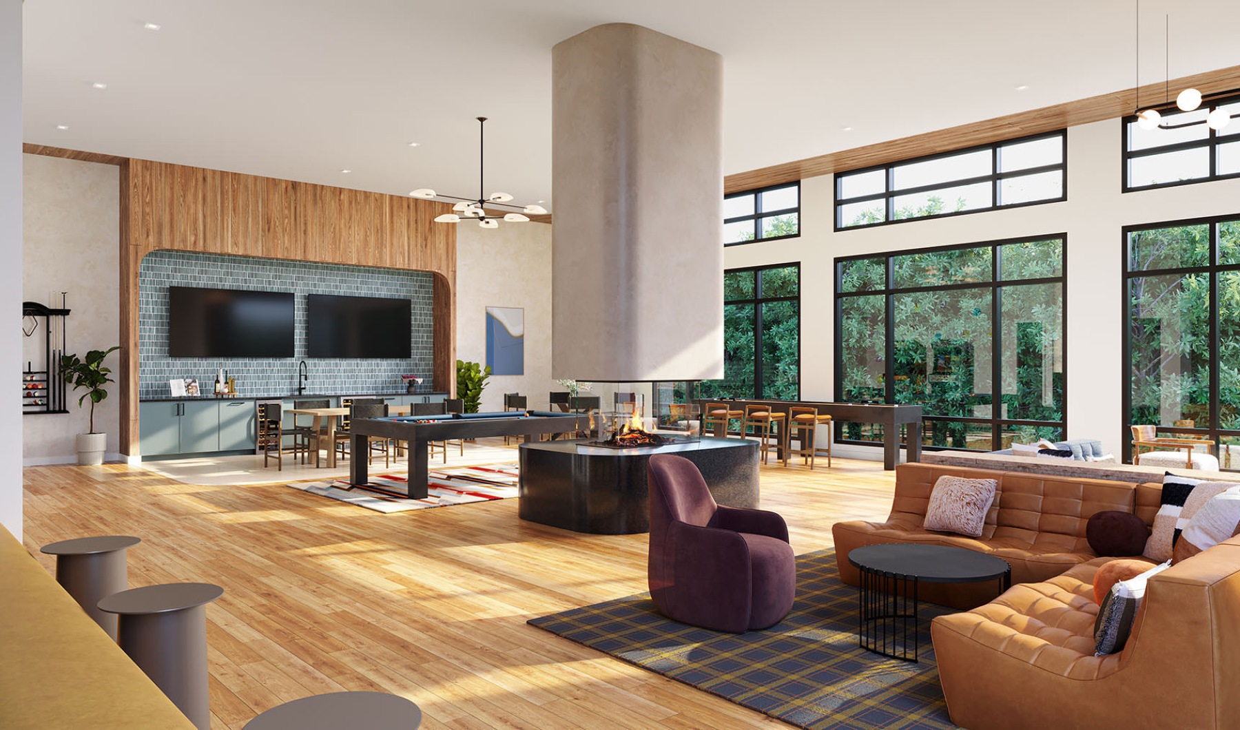a clubroom with tv's, tables, chairs and couches